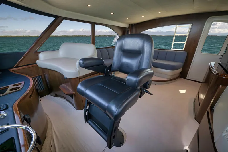 Slide: The Image of Luxurious interior of 2015 Viking 76 Enclosed Bridge yacht with leather seating. - 24