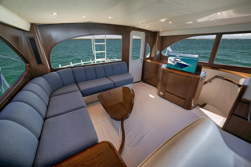 Slide: The Image of Luxurious interior of 2015 Viking 76 Enclosed Bridge yacht with ocean view. - 25