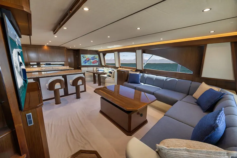 Slide: The Image of Luxurious interior of 2015 Viking 76 Enclosed Bridge yacht with elegant seating and ocean view. - 26
