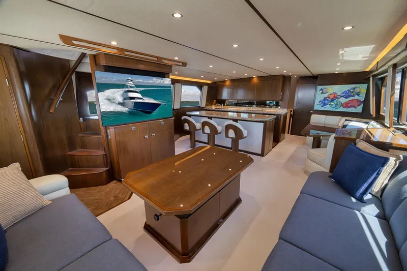 Slide: The Image of Luxurious interior of 2015 Viking 76 Enclosed Bridge yacht with elegant wood finishes. - 27