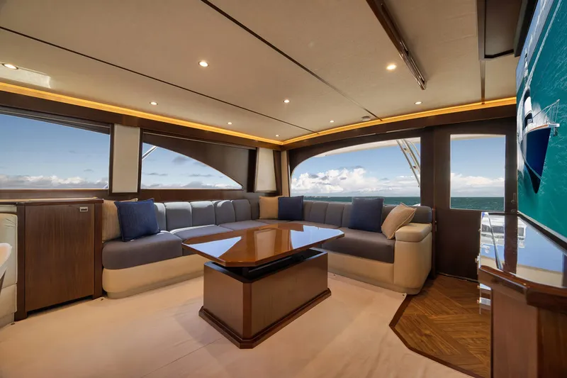 Slide: The Image of Luxurious interior of 2015 Viking 76 Enclosed Bridge yacht with ocean view. - 28