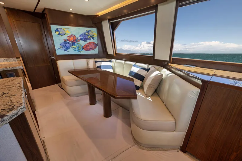 Slide: The Image of Luxurious interior of 2015 Viking 76 Enclosed Bridge yacht with ocean view. - 29
