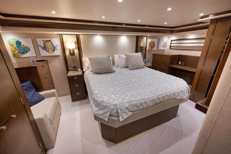 Slide: The Image of Luxurious bedroom interior of 2015 Viking 76 Enclosed Bridge yacht with modern decor. - 33
