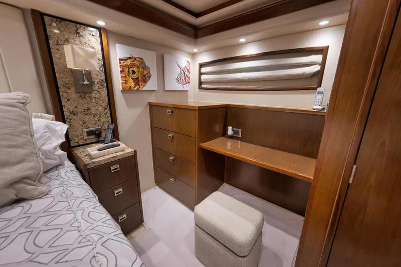 Slide: The Image of Luxurious cabin interior of 2015 Viking 76 Enclosed Bridge yacht with elegant wood finishes. - 35
