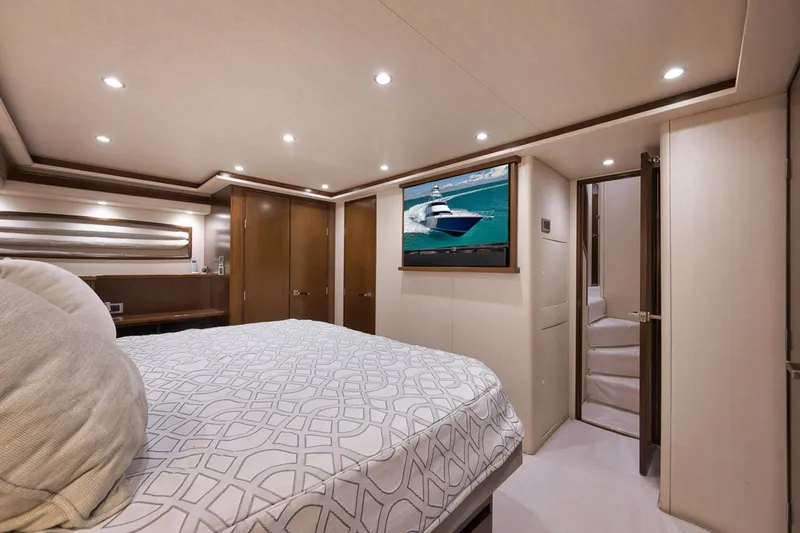 Slide: The Image of Luxurious bedroom interior of 2015 Viking 76 Enclosed Bridge yacht. - 37