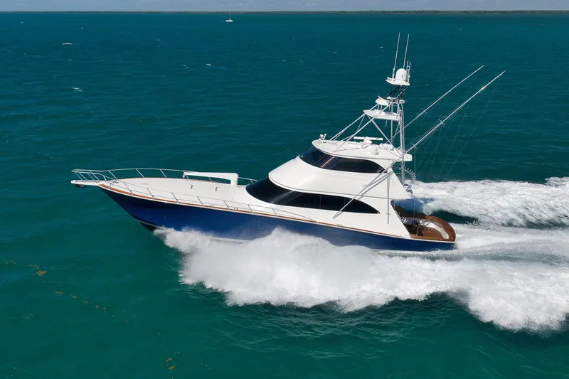 Slide: The Image of 2015 Viking 76 Enclosed Bridge yacht cruising on open sea. - 4