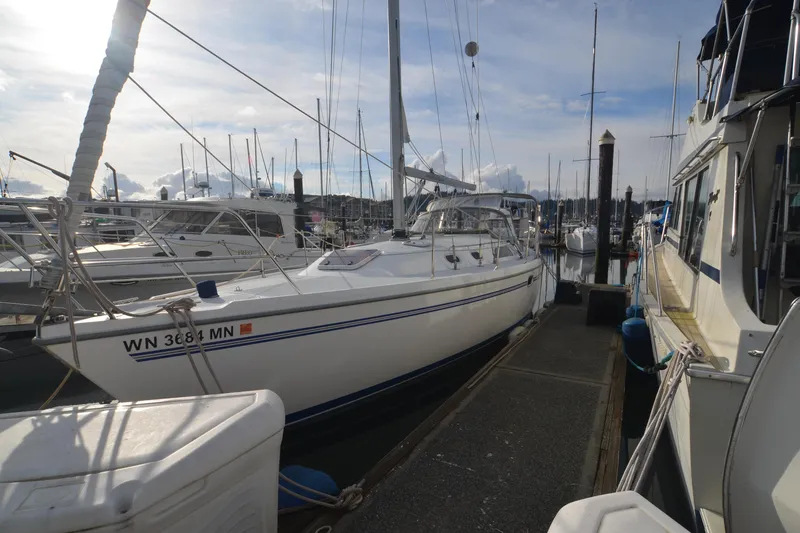 The Image of 2003 Catalina 36 MkII sailboat docked at marina under cloudy sky. - 0