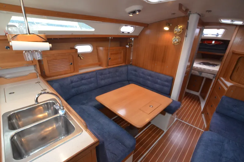 Slide: The Image of Interior of 2003 Catalina 36 MkII sailboat with cozy seating and wooden finishes. - 11