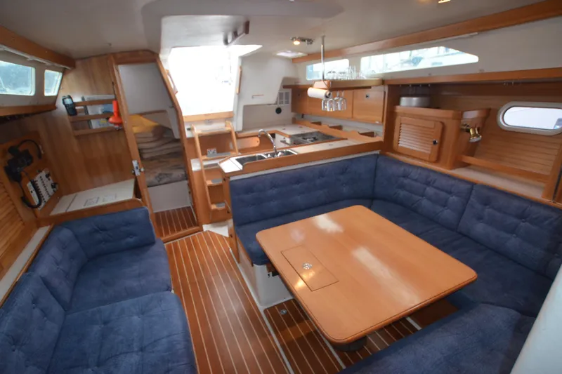 Slide: The Image of Interior of 2003 Catalina 36 MkII sailboat with cozy seating and wooden finishes. - 14