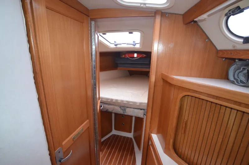 Slide: The Image of Interior cabin of a 2003 Catalina 36 MkII sailboat with wooden finishes. - 15