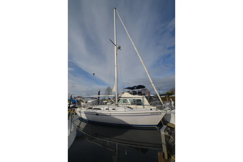 Slide: The Image of Catalina 36 MkII sailboat, 2003 model, docked at marina under clear sky. - 2