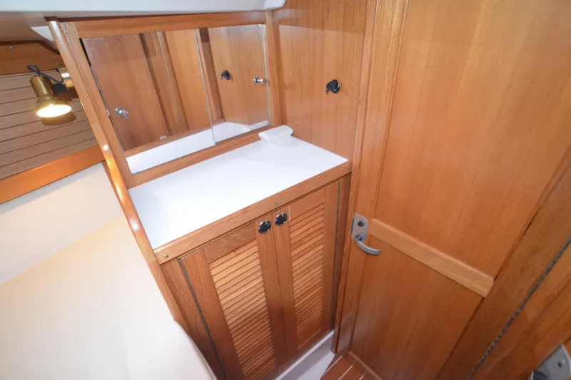 Slide: The Image of Wooden interior of 2003 Catalina 36 MkII sailboat with mirrored cabinet and door. - 20
