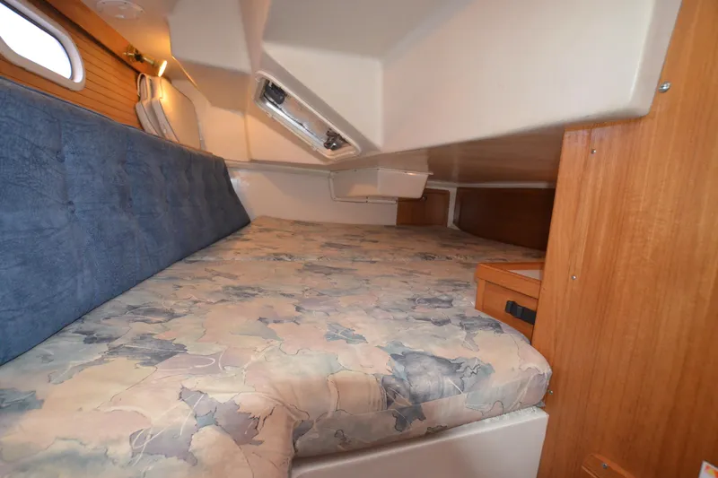 Slide: The Image of Cozy cabin interior of 2003 Catalina 36 MkII sailboat with comfortable bedding. - 25