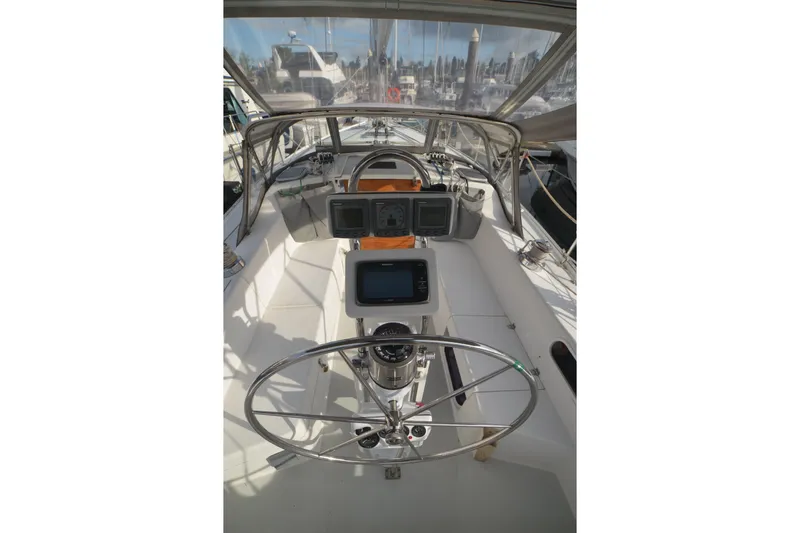 Slide: The Image of Cockpit of 2003 Catalina 36 MkII sailboat with steering wheel and navigation instruments. - 4
