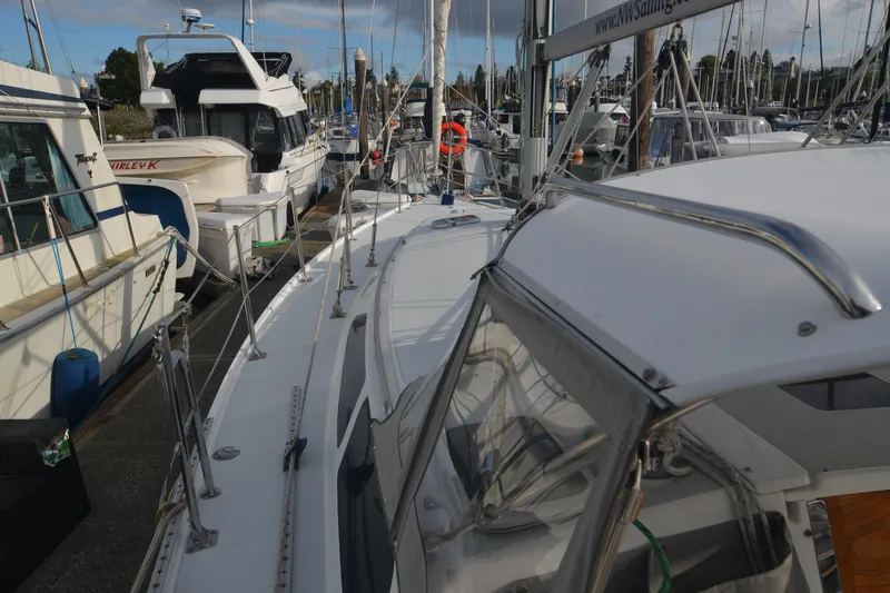 Slide: The Image of 2003 Catalina 36 MkII sailboat docked among other boats in a marina. - 5