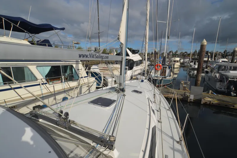Slide: The Image of 2003 Catalina 36 MkII sailboat docked at marina under cloudy sky. - 6