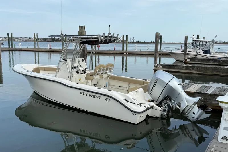 The Image of 2017 Key West 239 FS boat docked with Honda outboard motor. - 0