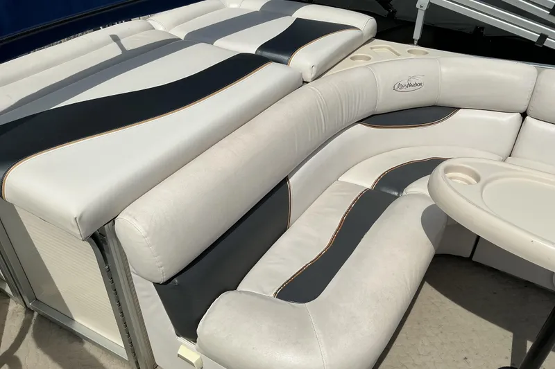 Slide: The Image of 2008 Misty Harbor 2285GM Grand Mistique boat interior with white and black seating. - 10