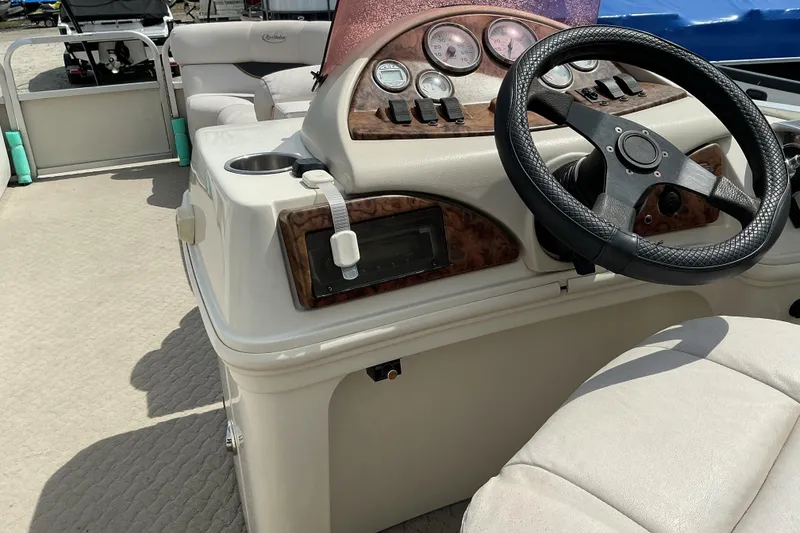Slide: The Image of 2008 Misty Harbor 2285GM Grand Mistique boat dashboard with steering wheel and gauges. - 12