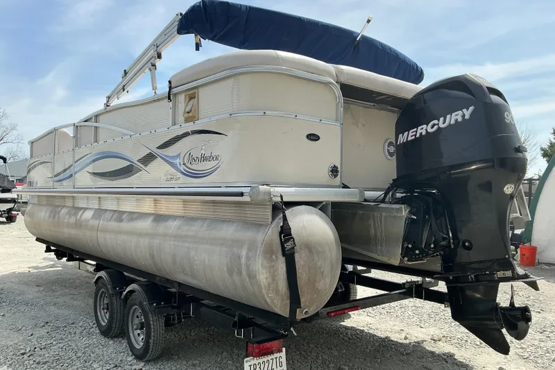 Slide: The Image of 2008 Misty Harbor 2285GM Grand Mistique pontoon boat with Mercury outboard motor on trailer. - 4