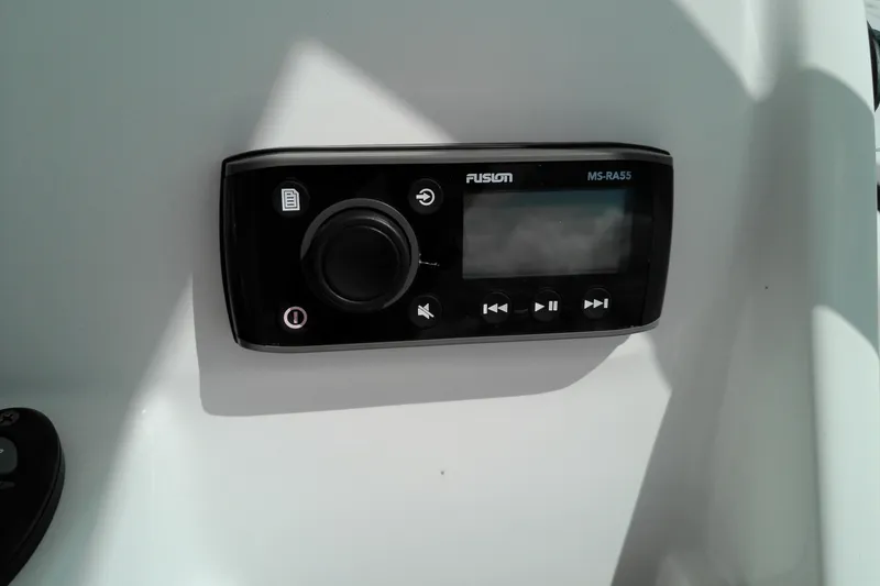 Slide: The Image of Fusion MS-RA55 stereo system on 2023 Glasstream 240 CC boat dashboard. - 10