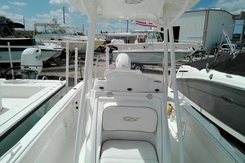 Slide: The Image of 2023 Glasstream 240 CC boat interior at a marina, surrounded by other boats. - 13