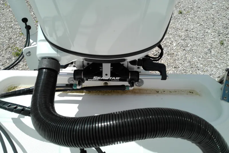 Slide: The Image of Close-up of 2023 Glasstream 240 CC boat's steering mechanism with SeaStar hydraulic system. - 25