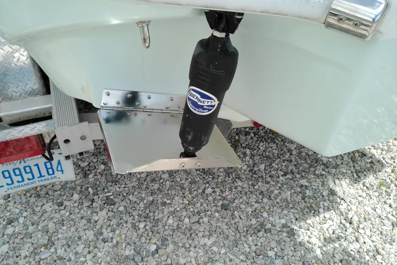 Slide: The Image of 2023 Glasstream 240 CC boat with Bennett Marine trim tab, on a trailer. - 26