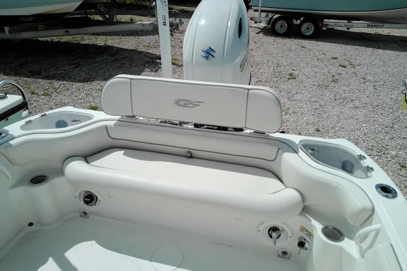 Slide: The Image of 2023 Glasstream 240 CC boat interior with white seating and Suzuki outboard motor. - 4