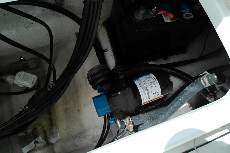 Slide: The Image of 2023 Glasstream 240 CC boat interior showing wiring and mechanical components. - 5