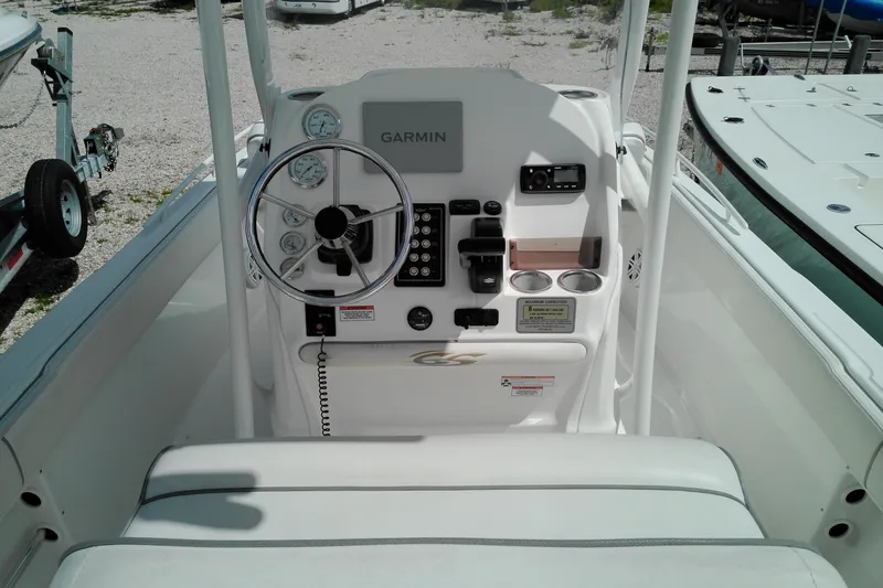 Slide: The Image of 2023 Glasstream 240 CC boat console with Garmin navigation and steering wheel. - 8