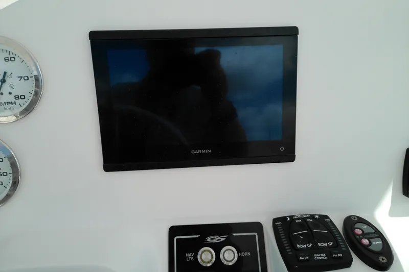 Slide: The Image of Dashboard of 2023 Glasstream 240 CC with Garmin display and controls. - 9