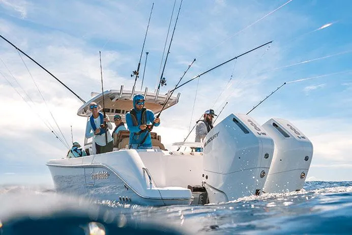 Slide: The Image of Manufacturer Provided Image: 2025 Everglades 315 Center Console boat with anglers fishing in open water. - 7