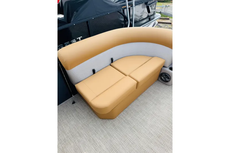 Slide: The Image of 2026 Crest Conquest SE 200 Cruise boat seating with tan upholstery and integrated speaker. - 10