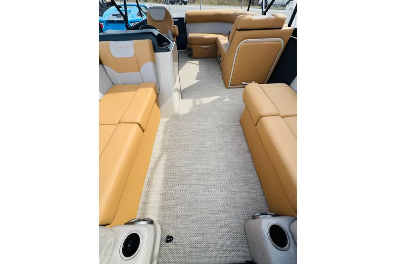 Slide: The Image of Interior of 2026 Crest Conquest SE 200 Cruise with tan seating and carpet flooring. - 12