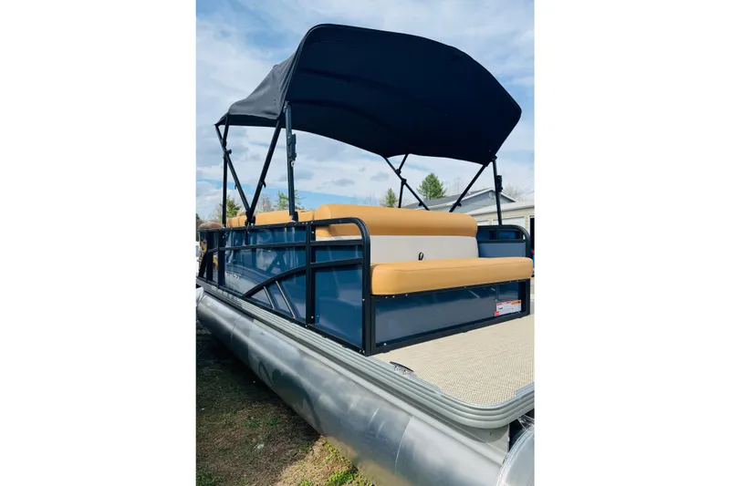 Slide: The Image of 2026 Crest Conquest SE 200 Cruise pontoon boat with canopy and tan seating. - 2