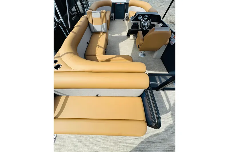 Slide: The Image of 2026 Crest Conquest SE 200 Cruise boat interior with tan seating and modern helm. - 3