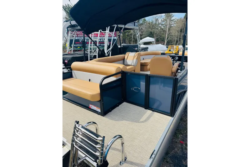 Slide: The Image of 2026 Crest Conquest SE 200 Cruise pontoon boat with tan seating and canopy. - 4