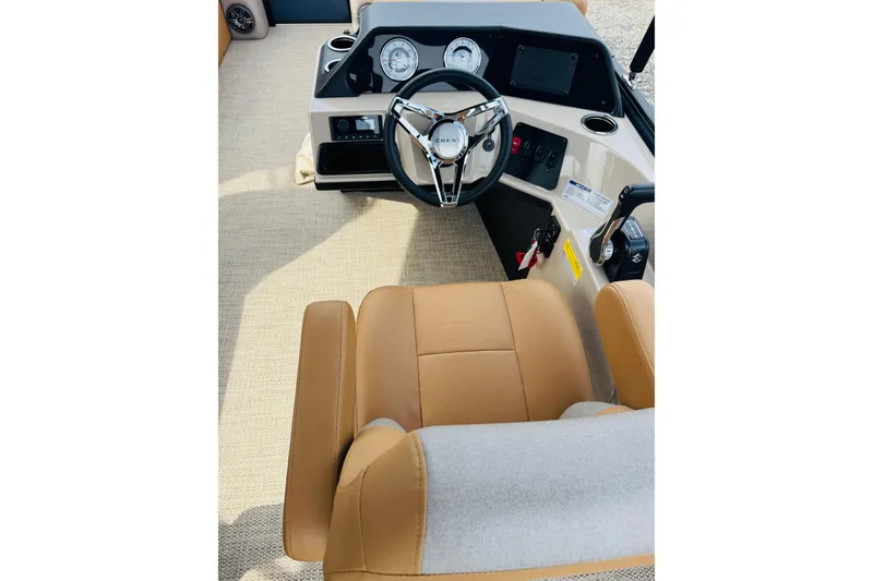 Slide: The Image of Captain's seat and helm of 2026 Crest Conquest SE 200 Cruise boat. - 9