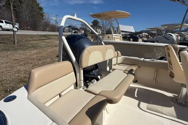 Slide: The Image of 2022 Scout 195 Sport Dorado boat interior with beige seating and outboard motor. - 4
