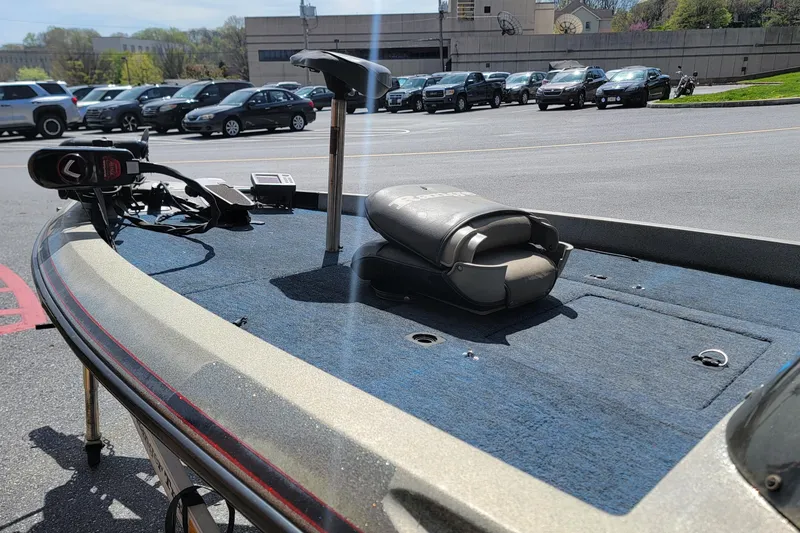 Slide: The Image of 1995 Ranger boat deck with trolling motor and seat in parking lot. - 4