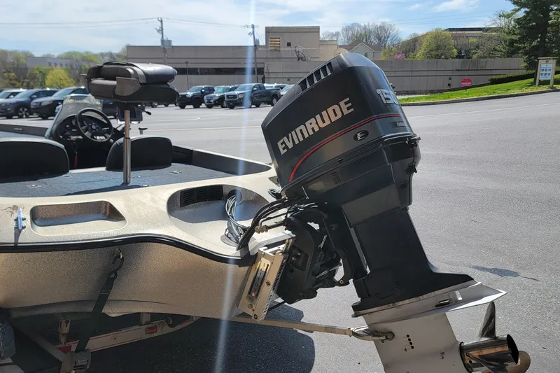 Slide: The Image of 1995 Ranger boat with Evinrude 150 outboard motor in parking lot. - 7