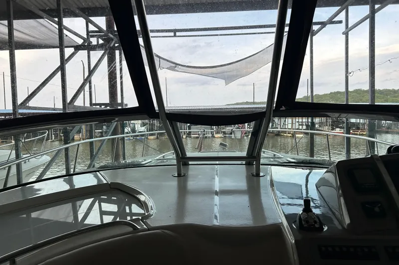 Slide: The Image of Interior view from a 2010 Chaparral Signature 370 boat docked at a marina. - 16