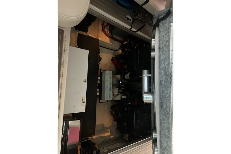 Slide: The Image of Engine compartment of a 2010 Chaparral Signature 370 boat, showcasing mechanical components. - 21