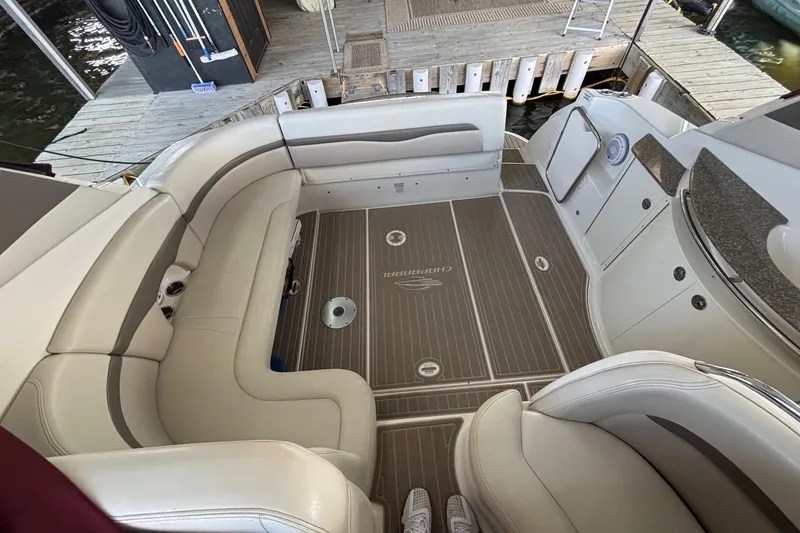 Slide: The Image of Interior of 2010 Chaparral Signature 370 boat with beige seating and wood-patterned flooring. - 23