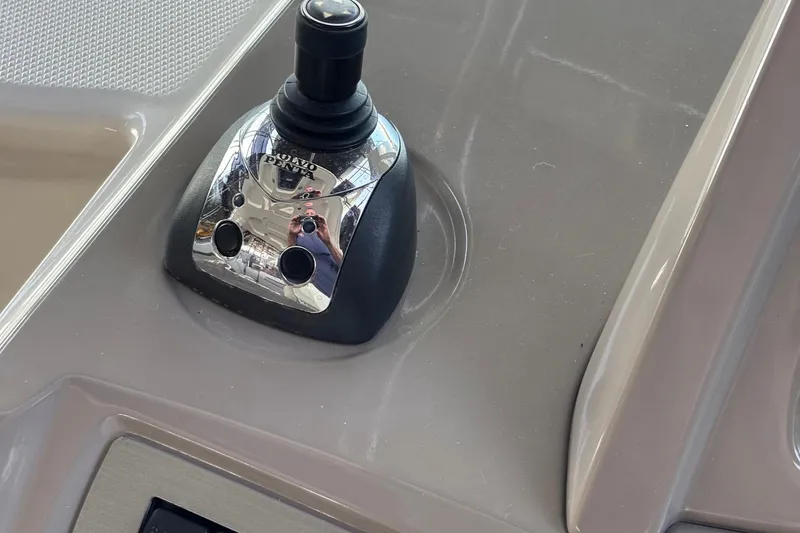 Slide: The Image of Joystick control on 2010 Chaparral Signature 370 boat dashboard. - 25