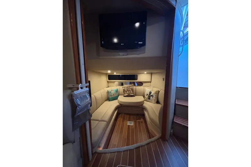 Slide: The Image of Interior of 2010 Chaparral Signature 370 yacht with cozy seating and TV. - 27