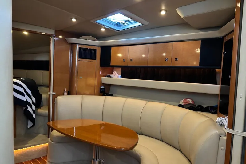 Slide: The Image of Luxurious interior of 2010 Chaparral Signature 370 yacht with plush seating and wooden accents. - 32