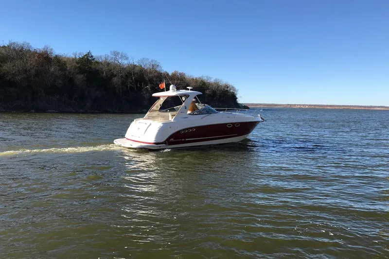 Slide: The Image of 2010 Chaparral Signature 370 cruising on a calm lake under clear blue skies. - 4