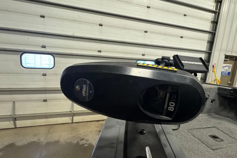 Slide: The Image of 2017 Tracker Targa V-18 WT boat with iPilot trolling motor in a garage. - 14